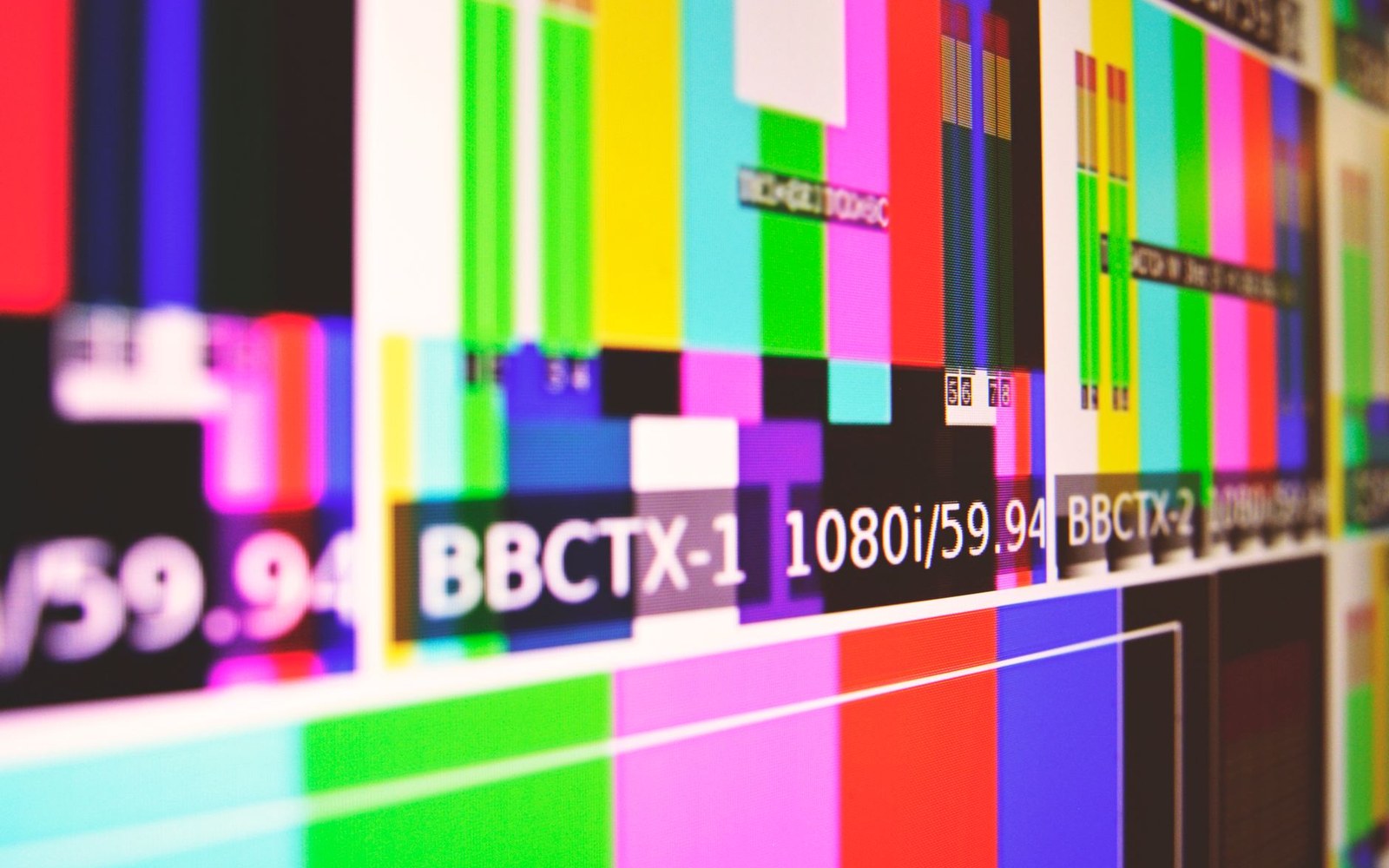 Colour bar test pattern on screens showing channel labels BBCTX-1 and BBCTX-2